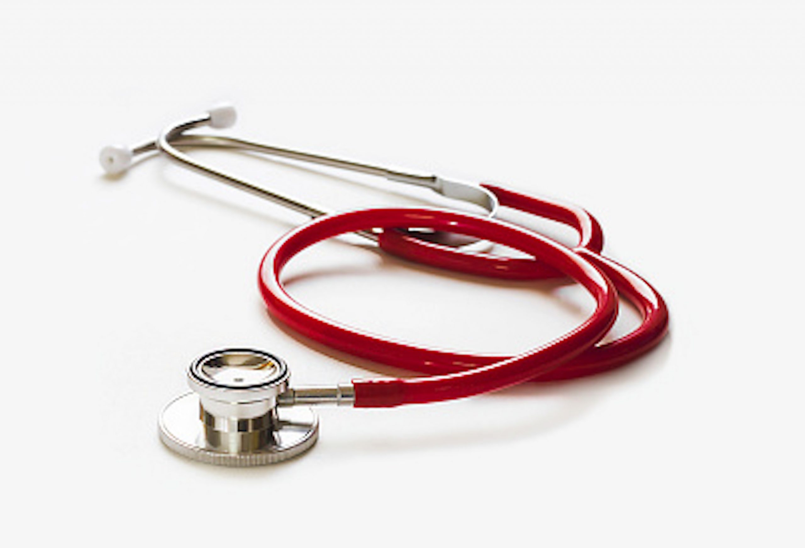 red stethoscope on gray background ,health care concept.